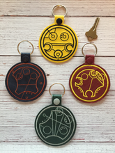 Load image into Gallery viewer, Key Fobs Inspired By Gallifreyan Magical Houses - Keychain - Backpack Decoration - Bag Bling